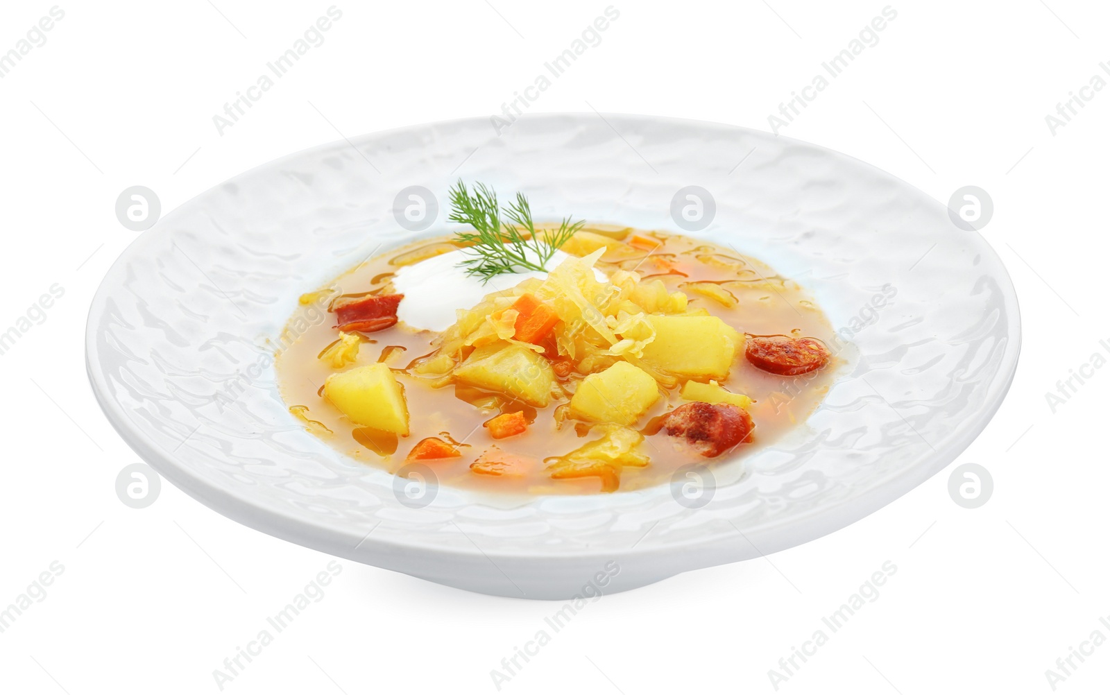 Photo of Delicious sauerkraut soup with smoked sausages dill and sour cream isolated on white