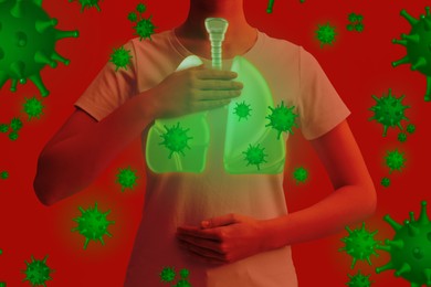 Woman holding hands near chest with illustration of lungs and viruses that surrounding her on red background, closeup