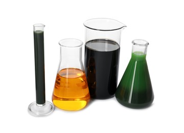 Beaker, test tube and flasks with different types of oil isolated on white