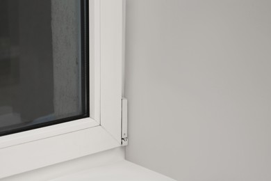 Photo of Glass plastic window near white wall indoors
