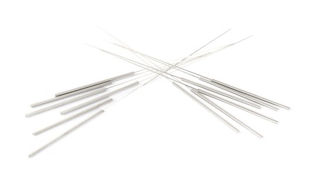 Photo of Many needles for acupuncture on white background