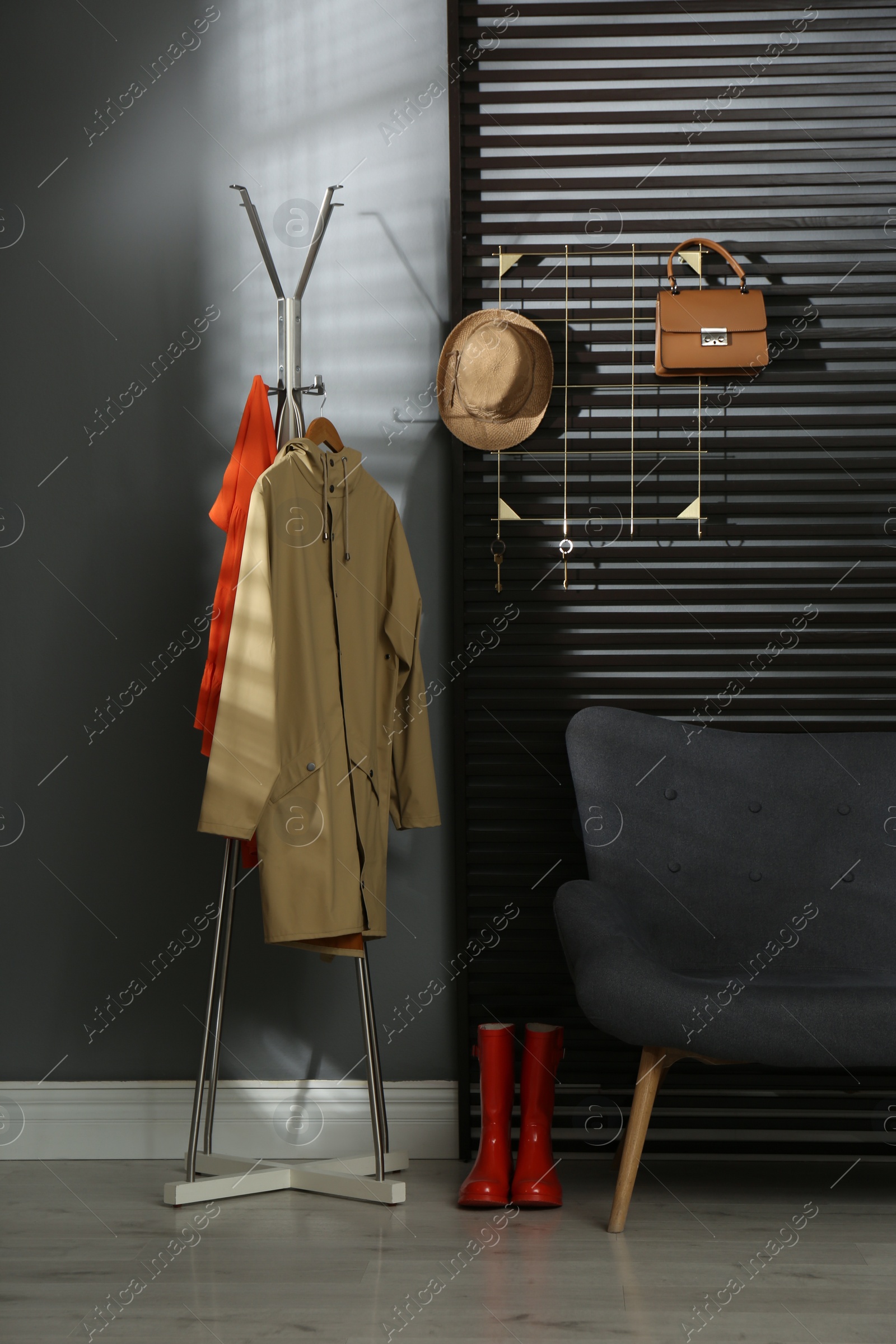 Photo of Hallway interior with sofa, clothes and accessories