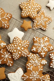 Photo of Tasty Christmas cookies with icing on light table, flat lay