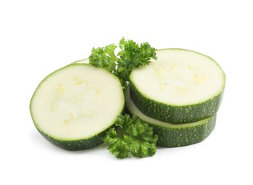 Cut green ripe zucchini and parsley isolated on white