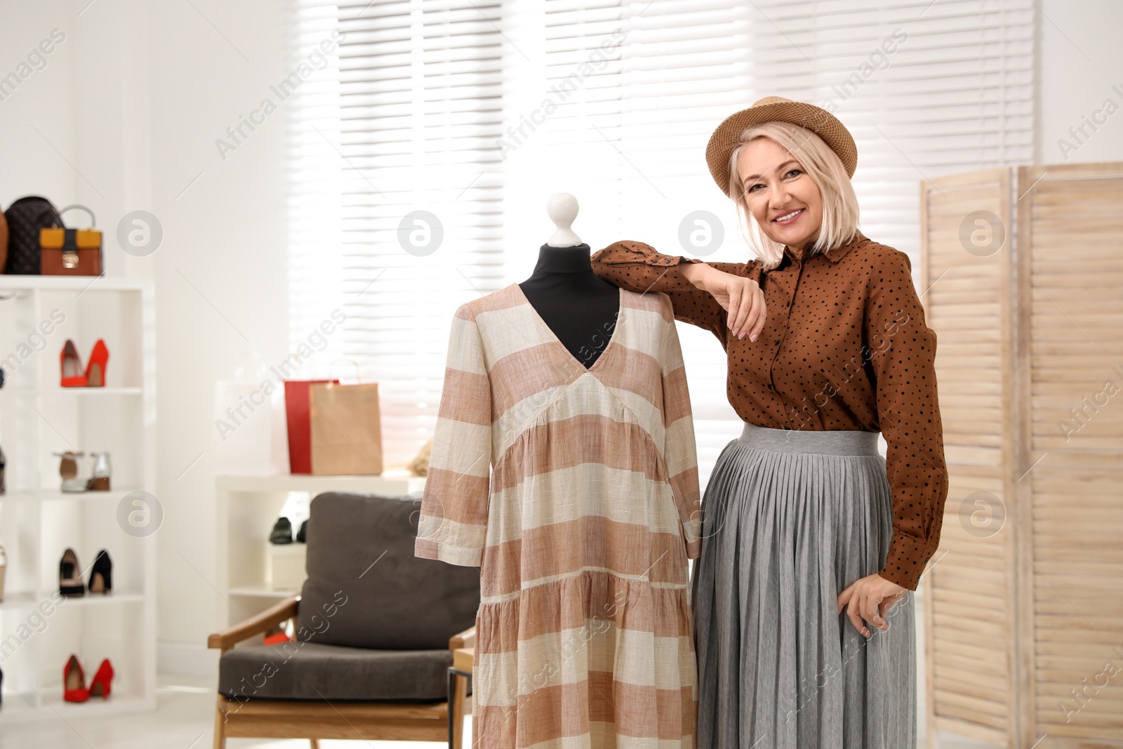 Photo of Confident female business owner in her boutique