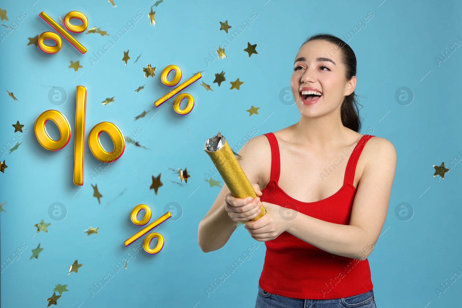 Image of Discount offer. Happy young woman blowing up party popper on light blue background. Confetti and percent signs in air