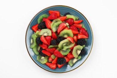 Photo of Plate of yummy fruit salad on white background, top view