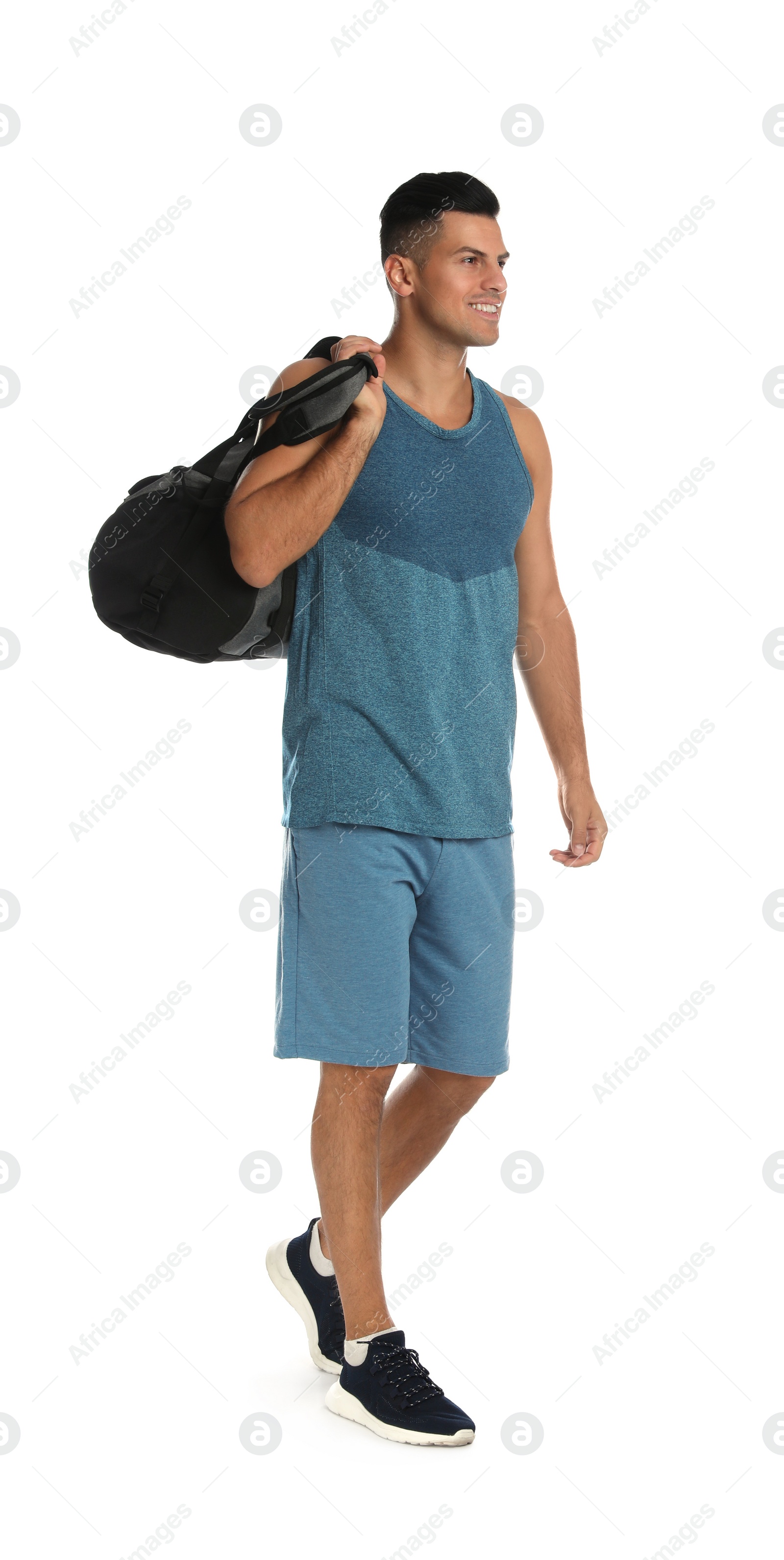 Photo of Handsome man with sports bag on white background