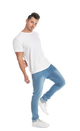 Young man in stylish jeans on white background