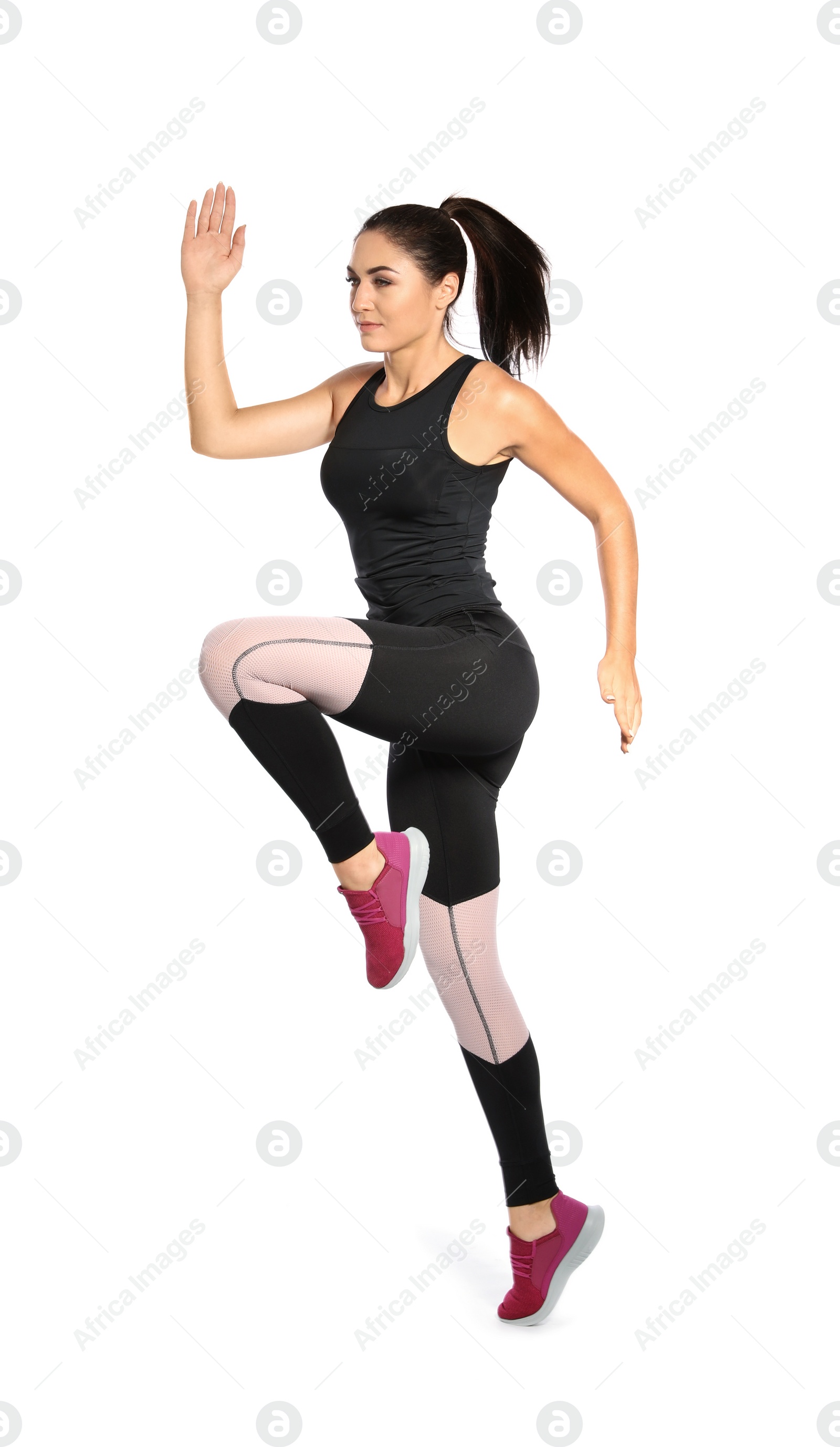 Photo of Sporty young woman running on white background