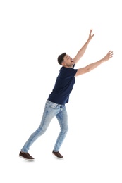 Emotional man in casual clothes posing on white background