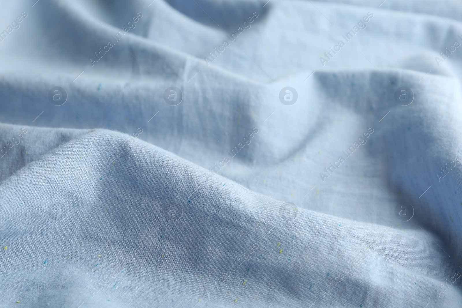 Photo of Texture of light blue fabric as background, closeup