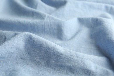 Texture of light blue fabric as background, closeup