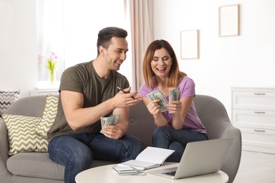 Couple managing budget to save money in living room