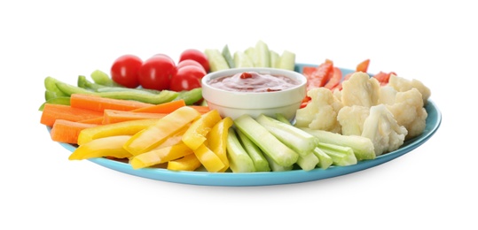 Photo of Plate with celery sticks, other vegetables and dip sauce isolated on white