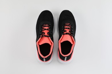 Photo of Pair of stylish sport shoes on white background, flat lay