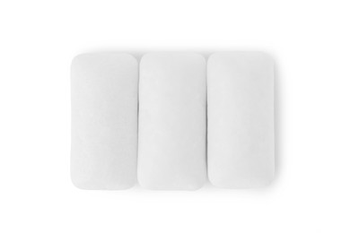 Photo of Tasty chewing gums on white background, top view