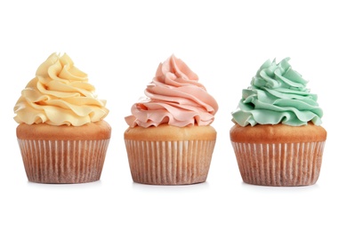 Photo of Delicious cupcakes with cream on white background