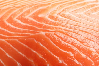 Photo of Raw salmon fillet as background, closeup
