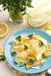 Tasty salad with Chinese cabbage and products on beige table, above view