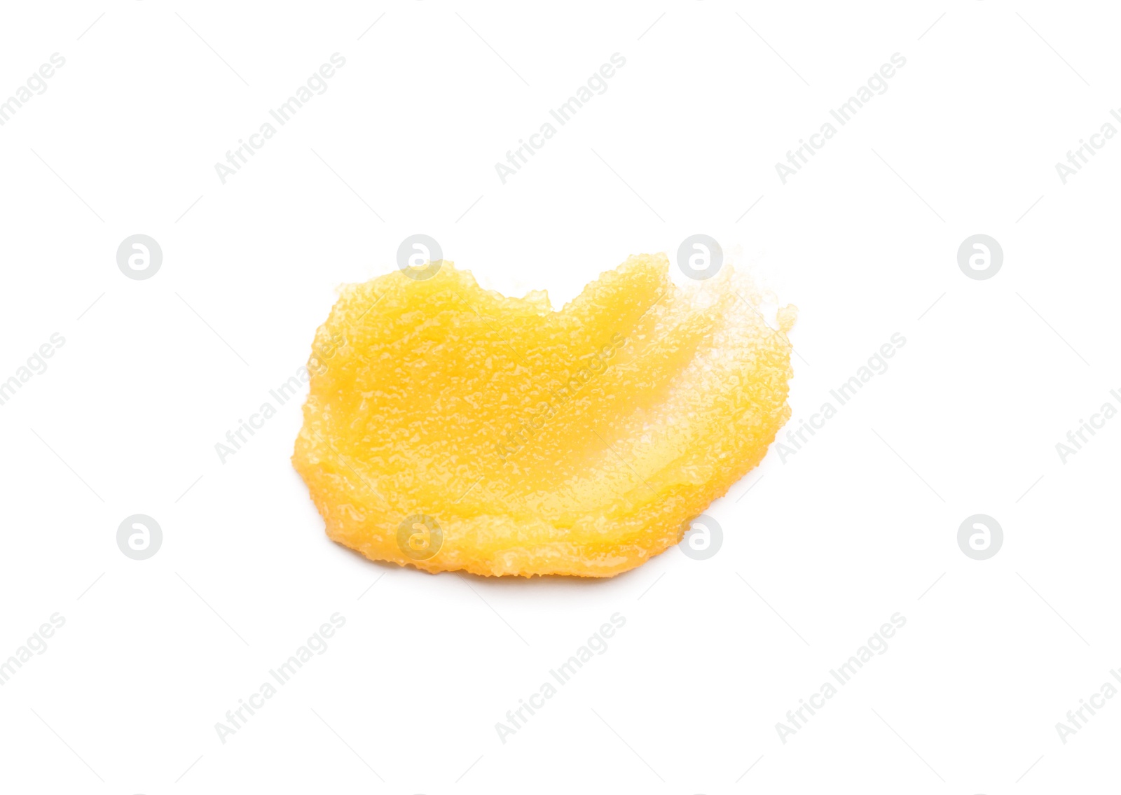 Photo of Smear of orange body scrub isolated on white, top view