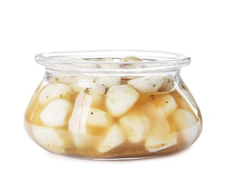 Photo of Glass jar with preserved garlic on white background