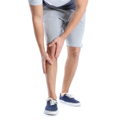 Photo of Man suffering from leg pain on white background, closeup