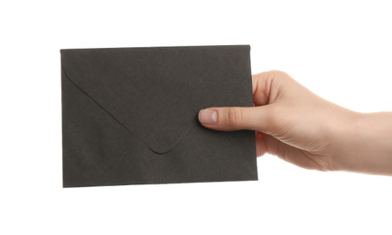 Photo of Woman holding black paper envelope on white background, closeup