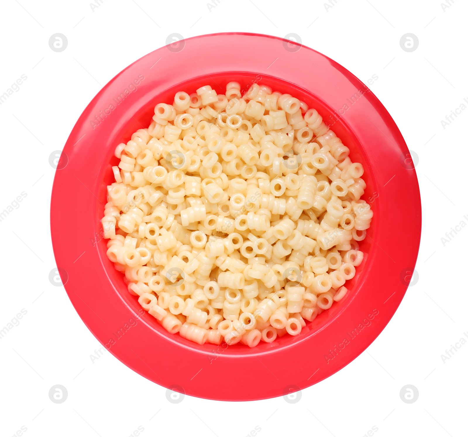 Photo of Red bowl with tasty pasta on white background, top view