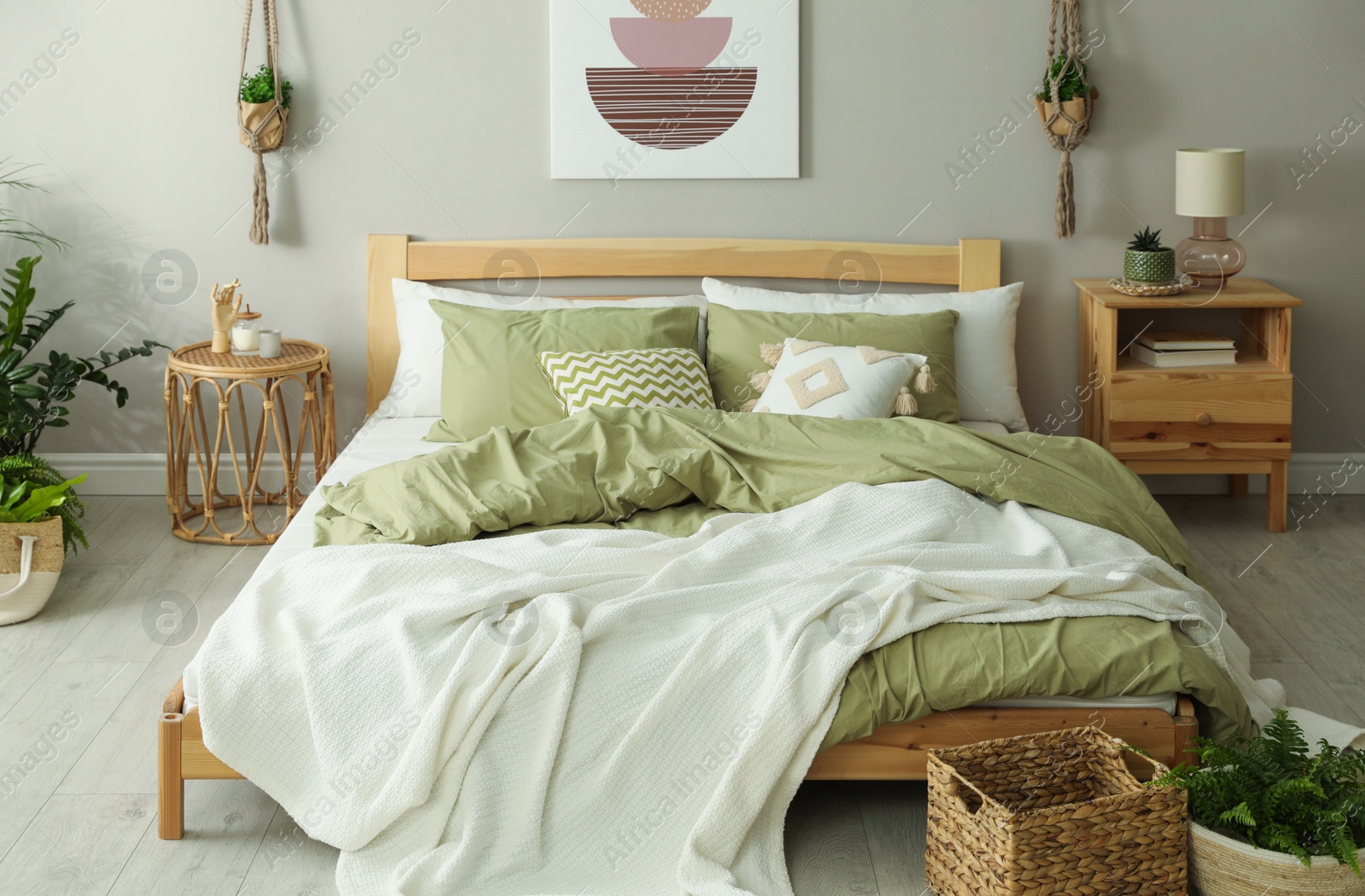 Photo of Stylish room interior with comfortable wooden bed