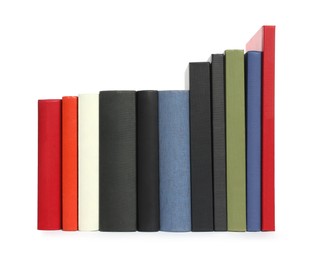 Photo of Many different hardcover books on white background