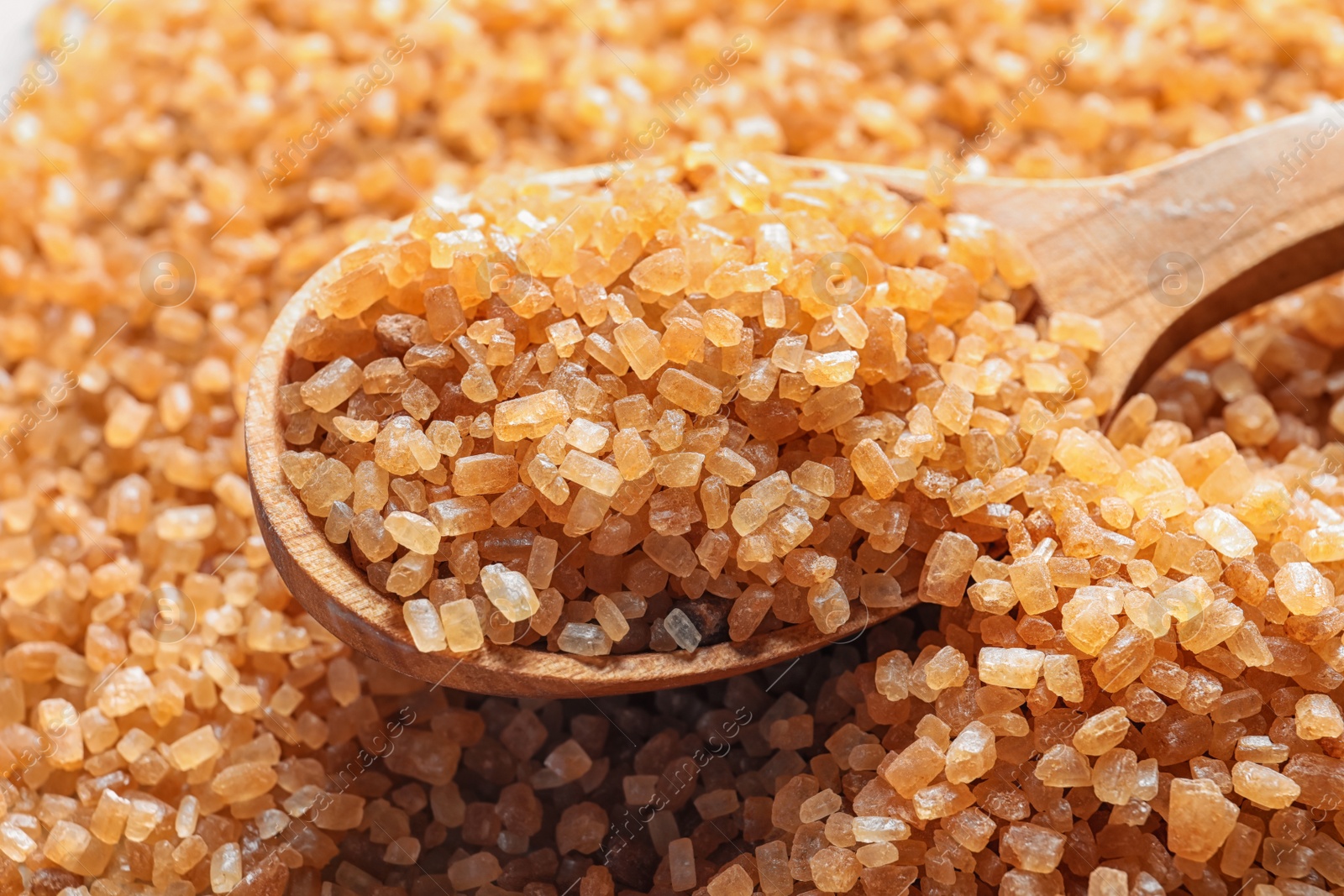 Photo of Spoon with brown sugar, closeup