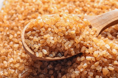 Spoon with brown sugar, closeup