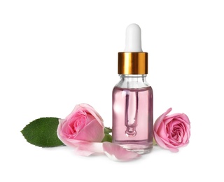 Bottle of essential oil and roses on white background