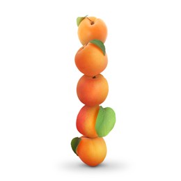 Stack of fresh ripe apricots on white background