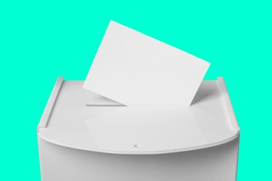 Image of Ballot box with vote on turquoise background. Election time
