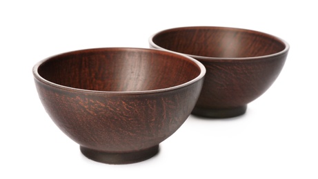 Stylish brown clay bowls on white background