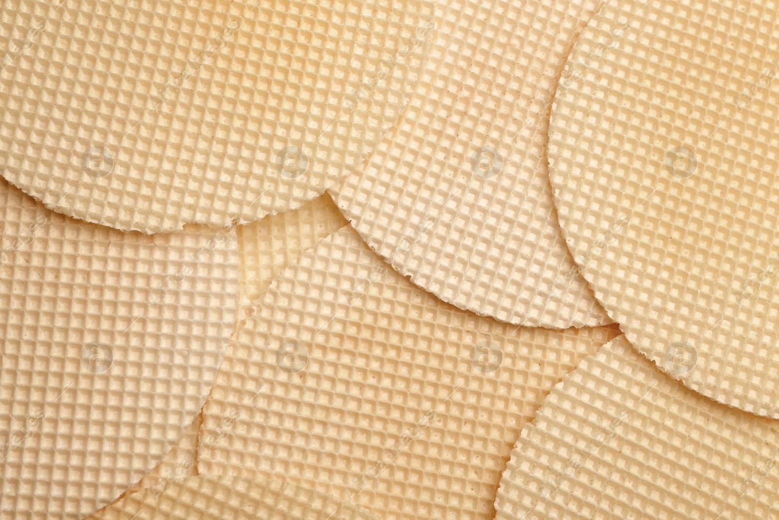 Photo of Tasty wafers as background, closeup. Crispy food