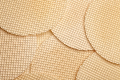 Photo of Tasty wafers as background, closeup. Crispy food