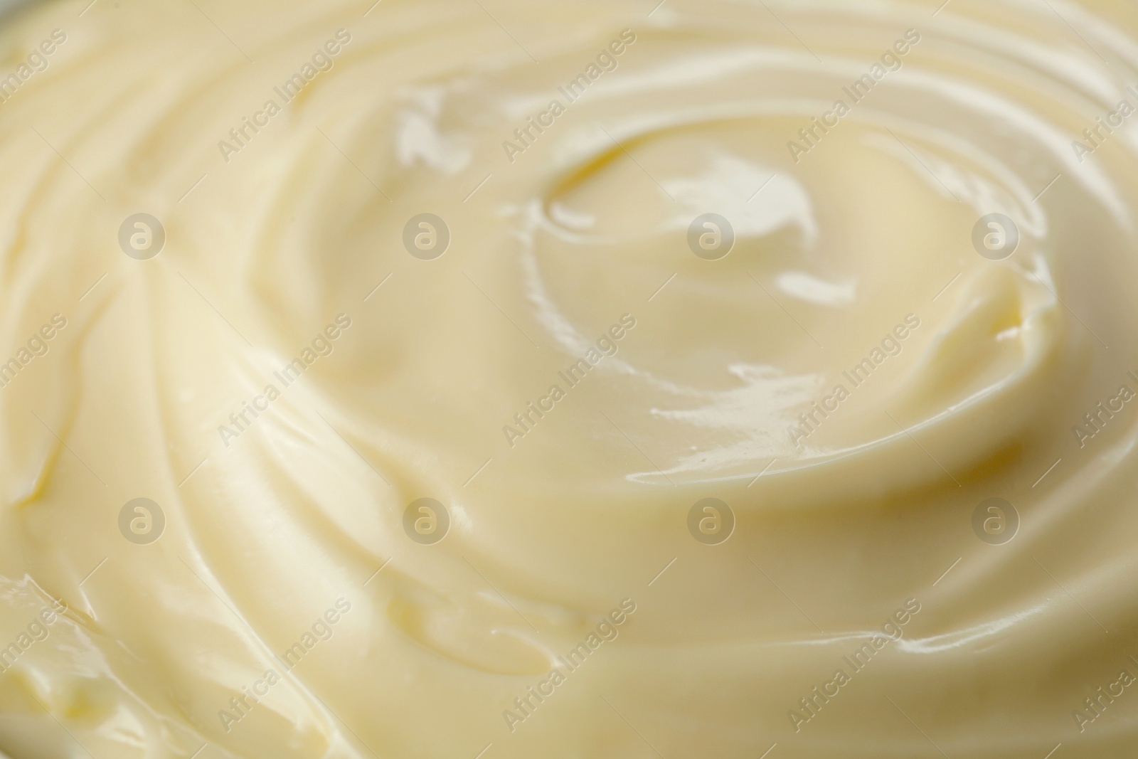 Photo of Fresh mayonnaise sauce as background, closeup view