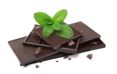 Photo of Tasty dark chocolate pieces with mint on white background