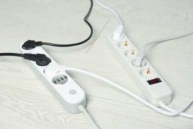 Photo of Extension cords on floor. Electrician's professional equipment