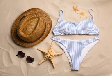 Flat lay composition with beach objects on sand