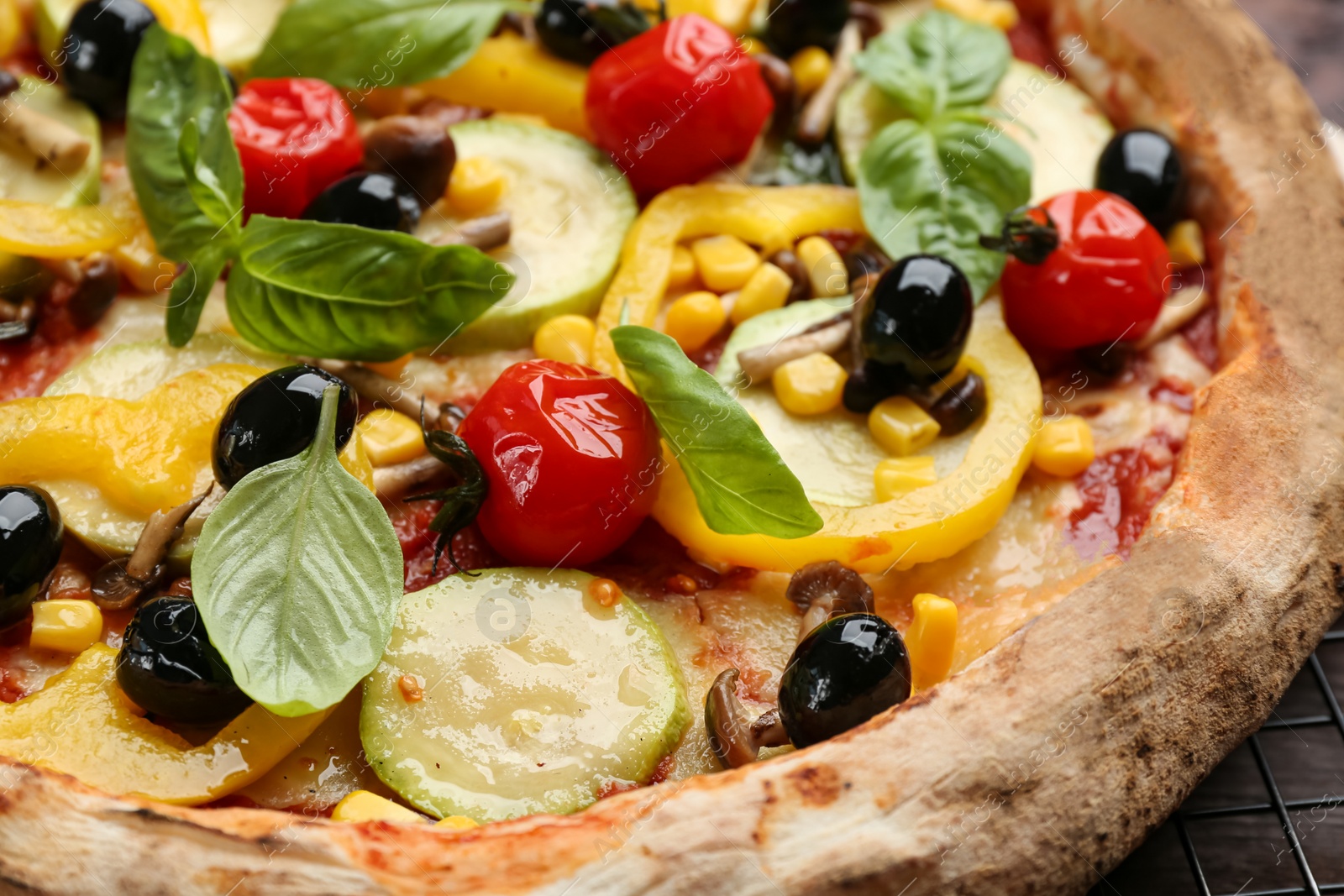 Photo of Delicious fresh vegetable pizza on table, closeup