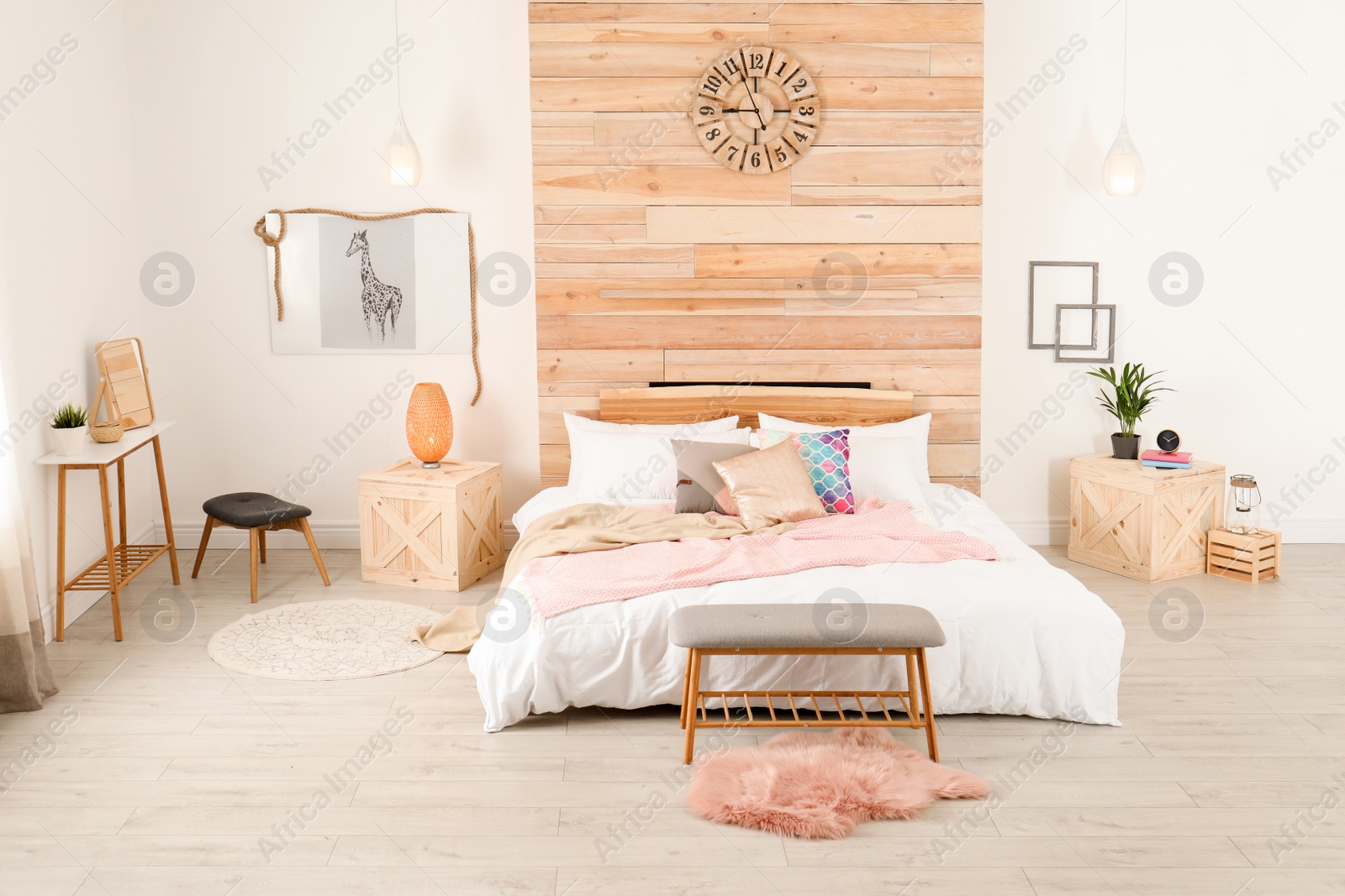 Photo of Stylish room interior with comfortable bed near wooden wall
