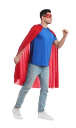 Photo of Man wearing superhero cape and mask on white background