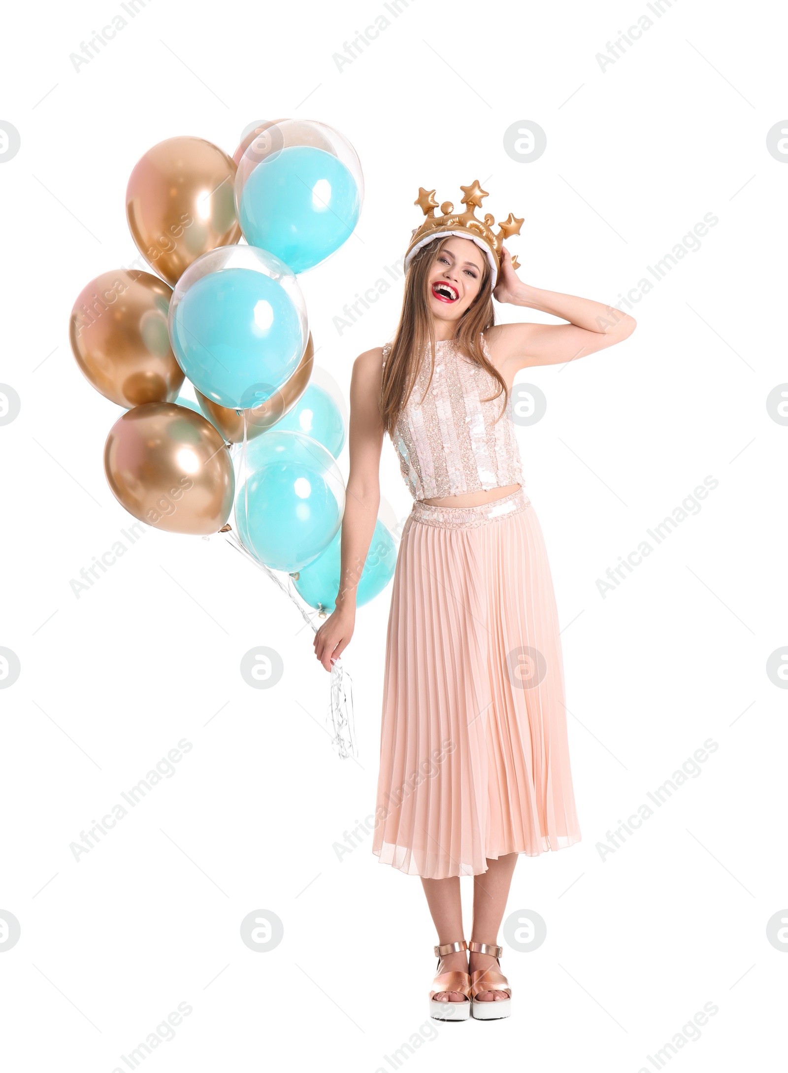 Photo of Young woman with crown and air balloons on white background