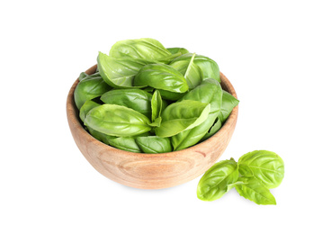 Photo of Fresh green basil leaves in wooden bowl isolated on white