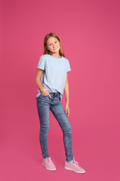 Photo of Full length portrait of preteen girl on pink background
