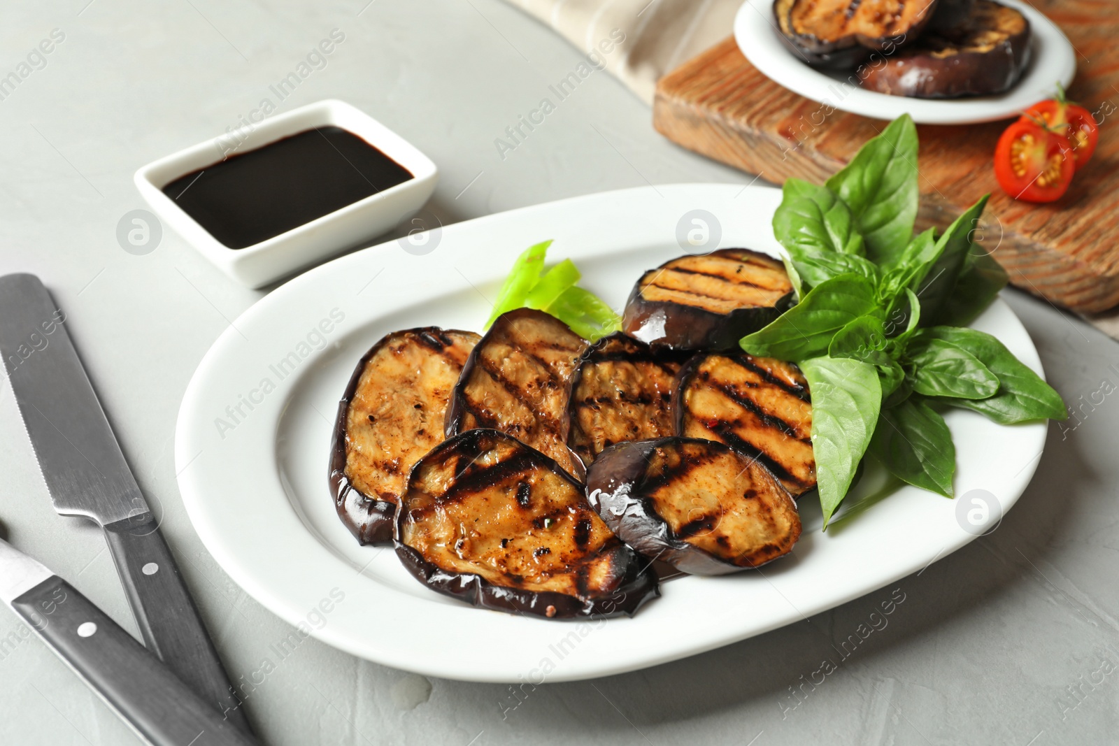 Photo of Plate with fried eggplant slices on table